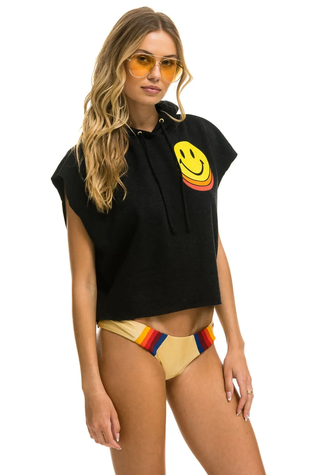 SMILEY SUNSET SLEEVELESS RELAXED CROPPED PULLOVER HOODIE - BLACK